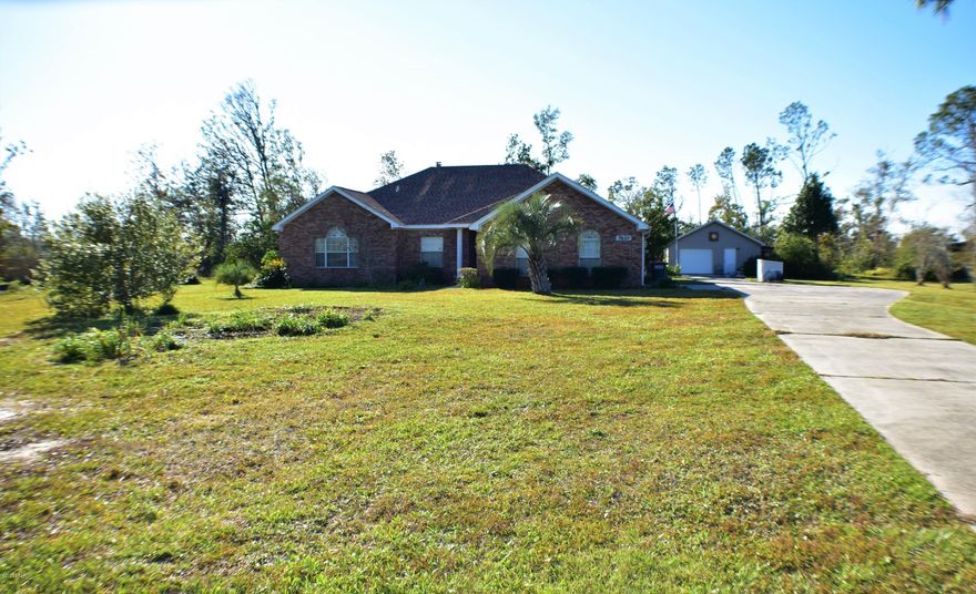 CURRENTLY UNDER CONTRACT, SELLER ACCEPTING BACKUP OFFERS. Fantastic 3BR/2.5BA brick home on 1.98 acres in the Kingswood area!  This home has a 2019 roof, an attached two car garage, a detached garage/workshop with side screened porch/greenhouse!  The interior boasts a cathedral ceiling, a study with french doors, fireplace, eat-in kitchen with walk-in pantry and center island, a box ceiling in the master bedroom, double sinks and a huge walk-in closet in the master bath, and a lovely Florida room with a mini-split.  This home is ideal for a family who likes country living but wants to stay close enough to town and shopping which is just 10 minutes away!  All info is approx. and must be verified by Buyers if important.