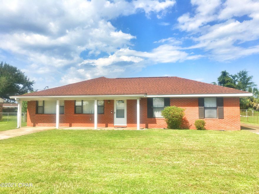 All brick home w/ rear-facing 2-Car Garage and large, comfortable living space. Once a 3 bedroom home, it was completely remodeled in 2010 & changed into a 2 bedroom with a huge master suite that includes an office/sitting area. Great closets throughout and a wonderfully spacious laundry/mudroom. The Kitchen boasts tons of solid wood cabinets, tile flooring, plus a passthrough to the diningroom/familyroom. Plenty of square footage if you wanted to steal some for a third or even fourth bedroom. House also comes with a WHOLE-HOUSE GENERATOR, new roof in 2019, and seller will consider offering a carpeting allowance with an acceptable offer.  High & dry, no flood insurance required, it is just around the corner from the walking park and convenient to Tyndall AFB, the Mill, & Eastern Shipyard,.