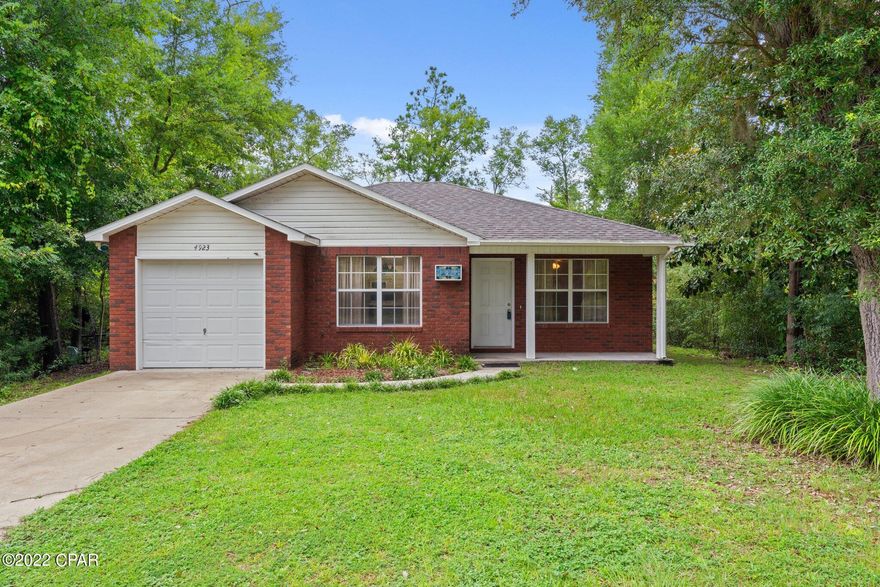 This adorable home has 3 bedrooms (or 2 bedrooms and an office), 2 bathrooms and lots of woods all around it. Water filtration is included, well and septic so no water bill! The home has been well cared for and has a very large, fenced in yard. This yard would be great for pets. In the garage you can check out the custom built Murphy work table- so neat! Roof, air conditioner and fence were replaced after the hurricane- the ouse had very minimal damage- just a couple of missing shingles. If you go by at night you can see the custom stained glass house numbers that come on at night with a sensor. This lovely home is available for showing!