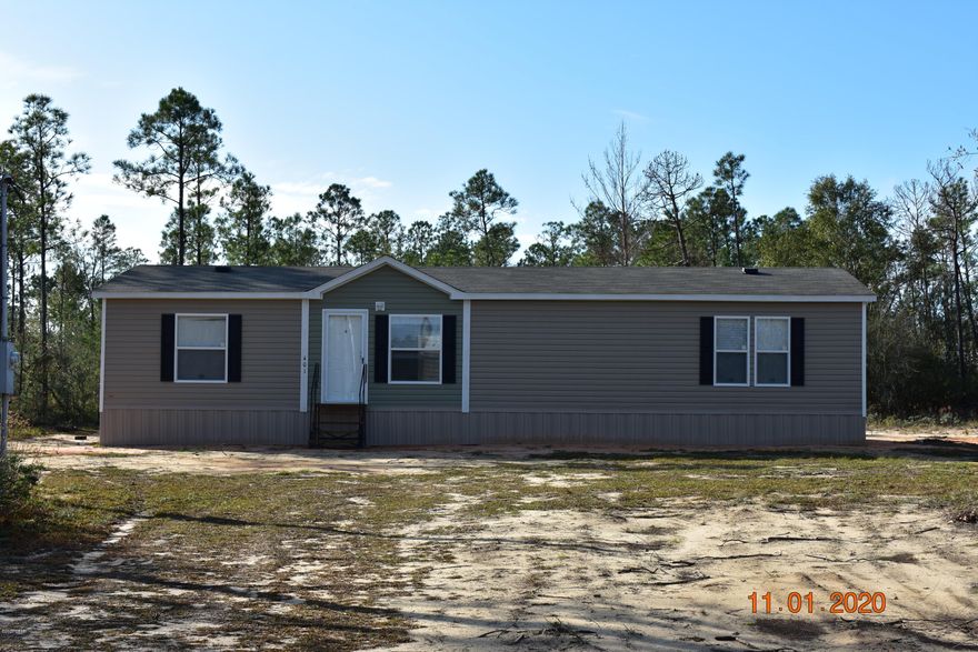 *Currently under contract, seller accepting back up offers*. Brand new 2020  3/2 manufactured home on nearly 6 acres in the country.  Quiet, peaceful area with lots of wildlife for watchful enjoyment or hunting. The lot is cleared only around home (approximate 0.25 acre -/+) and the rest is wooded, can be left for trail riding/hunting or cleared to expand yard area.  (Buckhorn Blvd has been approved for paving before end of 2020 and once this is done you will be less than 1/2 mile on dirt rd. ). New updated survey that shows improvements on file.