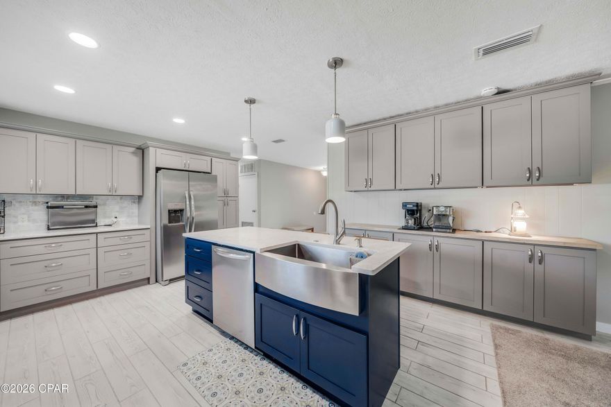 Did you know that Lynn Haven is consistently named as one of the top 10 safest cities in Florida? For 2026, Moving Waldo ranked Lynn Haven as #2 in Florida for both safety and BEST quality of life! 
This property is a gem! Located in the heart of established, quintessential Lynn Haven, this remodeled, functional home has been lovingly modernized and maintained. Home has an opened up floorplan with new kitchen and appliances featuring storage galore, quartz countertops and tile backsplash. Wood burning fireplace, new tile wood-look flooring, new bathrooms, new windows, new hurricane rated garage door, solar panels for low utility costs, walk in closets, and more.  This brick rancher, sits on a quiet street surrounded by woods on 2 sides, creating privacy and lush, natural surroundings with wild life. The property even has a fantastic chicken coop. Convenient to shopping, grocery and The World's Most Beautiful Beaches!
Come see why this move-in-ready, 3 bedroom, 2 full bath should become your next home.