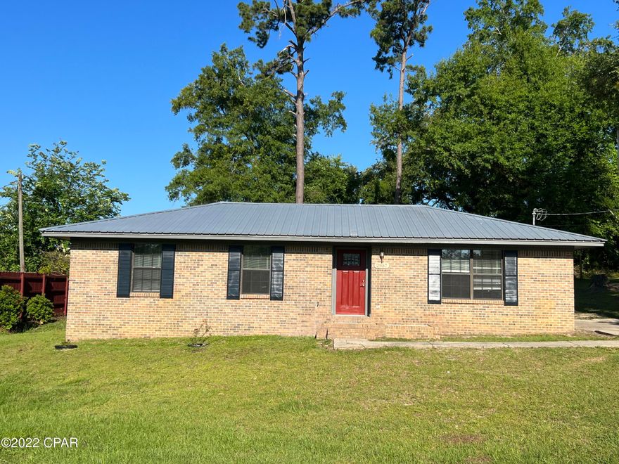 CURRENTLY UNDER CONTRACT, SELLER ACCEPTING BACKUP OFFERS--Like new is this Brick 3/1 move in ready, with all new flooring, all new paint, all new SS Appliances, all new tub/shower,toilet, Bathroom vanities, sinks, Counter tops, All new fixtures.  New front door with new rear sliding door.  Bonus bldg out back. Roof new in 2018. This home is move in ready.  Back yard has a fire pit, fig tree and large gardenia spread over fixture. All on  a paved street with easy access to all Marianna has to offer. Home comes with a 1 year warranty through American Home Shield. Survey available.