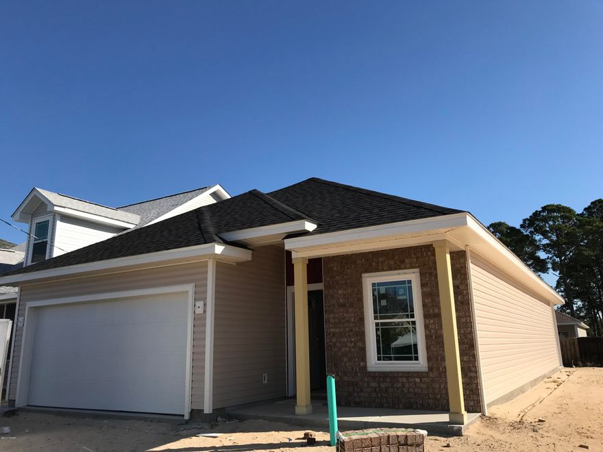 **100% FINANCING AVAILABLE***PC BEACH- 3/2 HOME**You're literally around the corner from the beach (1/2 mile to Gulf), Hutchison Elementary, Surfside Middle, Arnold High Schools and all of the convenient shopping, entertainment and restaurants at Pier Park! This home features 3 bedrooms and 2 full baths a covered patio and attached garage, tile and carpet flooring, 9' ceilings, separate dining area, open floor plan and large kitchen w/ breakfast bar perfect for entertaining. Lots of natural light and located in X flood zone-All dimensions, measurements and other listing information should be verified if deemed important. Materials subject