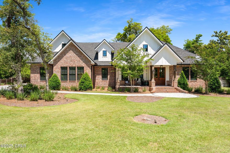 Welcome to luxury lakeside living in the highly sought after gated community of Cedar Creek at Deerpoint Lake. This custom-designed executive home is perfectly positioned on1.7 acres with 150 feet of pristine waterfront, offering stunning views and private access to one of the area's most sought-after lakes.

Boasting 3 spacious bedrooms, 3.5 elegantly appointed baths, and a large bonus room ideal for a home office, media room, or guest suite, this residence combines refined comfort with exceptional functionality. High-end craftsmanship is evident throughout, with distinctive Pecky Cypress accents adding warmth and character to the interior.  Other notable features include 2 Carrier Infinity high SEER HVAC Systems, deep well for irrigation, whole house generator and 1000 gallon buried propane tanks.

This home is built for peace of mind and recreation alike, featuring a fully fortified safe room with a professional-grade vault door, a private boat launch, and a dock with an electric lift—making lake access effortless for boating, fishing, and watersports.

For hobbyists or professionals, the property includes a massive, heated and cooled workshop exceeding 1,100 square feet, along with additional covered storage to house all your toys and equipment.

Host your friends in the newly remodeled clubhouse or throw a pool party at the Summer house equipped with bathrooms, showers and picnic tables.
With too many custom features to list, this one-of-a-kind home is a rare find—perfect for those seeking security, luxury, and the ultimate lakefront lifestyle.