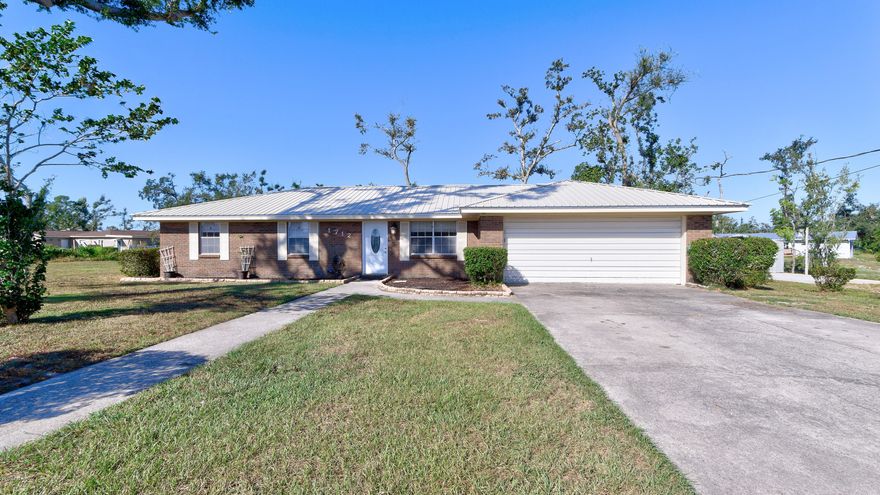 Located in Lynn Haven, this all brick, 3bd/2bth home is conveniently located near Hwy 390.

This home has brand new, premium metal roof, new vinyl flooring throughout living room/dining room/great room. Large eat-in kitchen offers granite counter-tops, stainless steel appliances and custom cabinetry. Great Room showcases beautiful vaulted beam ceilings and wood-burning brick fireplace, perfect for gatherings. Easily access the backyard through the newly installed french doors and take a stroll in the unique garden paved pathway. Backyard also offers new decking off the backside entrance from the kitchen and new yard shed for additional storage. Call /text your agent today to preview! All sizes/info/measurements are approx; please verify if important.