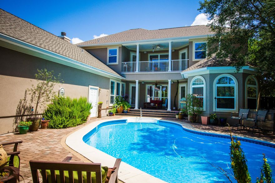 Last chance to buy this Gorgeous CUSTOM BUILT home by Ledman Construction...before it's too late! Home sits on a high bluff with impressive finishes throughout and a large free form pool. Parking is a plus with 3 car garage or parking in front on brick pavers. As you enter this stately home you will be presented into the formal Living area with 21'ceilings open to the 2nd floor! Formal Dining room on one side and official Office on the other & both rooms have large Bay windows overlooking a well manicured lawn. 1st floor continues into a HUGE Chef's kitchen with granite counters, stainless appliances, built in wine frig., chef's gas range with pot filler, pull out tray drawers and more counters and cabinets than most chef's would ever need. Perfect home for entertaining in mind. New Heat Pump Water Heater, Hot Water Circular System with Timer, 3 Separate Heat Pumps with Programmable Thermostats, Wood Burning Fireplace with Gas Starter, Electric Fireplace with Heat Settings, Security System, Vinyl Windows with Low-E Glass, Near Floor Window Tempered Glass, Structured Wiring For Cable-Internet and Phone Throughout, Built-in Speakers with Volume Controls to Stereo, Well Water Softener, Electric Outlets Located in Baseboards, Wall Safe, Huge Attic Storage Area with Interior Access Door, 2 x 6 Construction, Pool Door and Windows Alarm, New Pool Pump and Chlorine Dispenser, New Jet Well Pump, Landscape Lighting with Timers, 40 Year Architectural Roof Shingles, Drip Water System for Potted Plants in the Pool Area...there's more, must see for self!