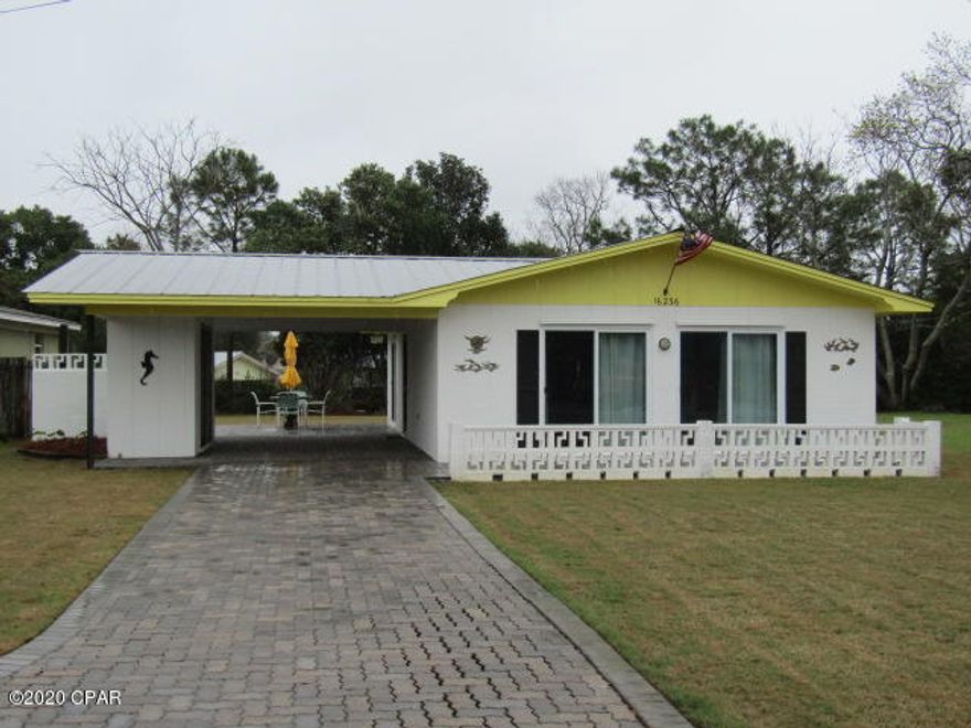 Beach cottage - 2 bedroom, 1 bath home featuring open living/dining area, breakfast bar with stools, terrazzo floors and paneled walls. Large brick paver patio area for entertaining. Storage shed.  Landlord provides water for sprinkler system and lawn weed control. Home is located near Hwy 79 with close proximity to beach. **$250 pet deposit/$50 pet fee/$25 pet rent (monthly)