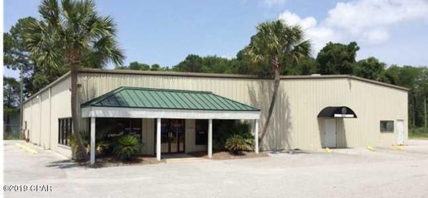 Large building with 9,180 square feet of space. Includes approximately 5,000 square feet of warehouse, four 12' x 14' roll up doors, 14' clear ceiling height, and 6,000 square feet of office-showroom.