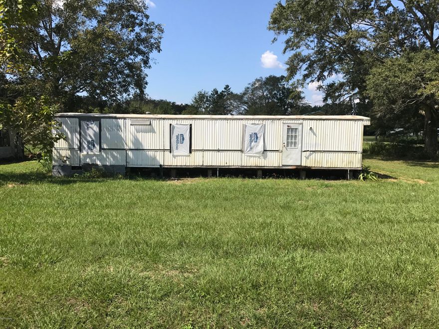 Nice lot for sale!  This lot is a corner lot on a paved Rd. Could be a great site for a newly constructed or manufactured home.  There is an older structure currently on the lot that could be fixed up or cleared.  Property has an older septic that will require inspection. Lot will require a well and electric.  Recently surveyed.  Make an appointment to come by and see this property's potential today!