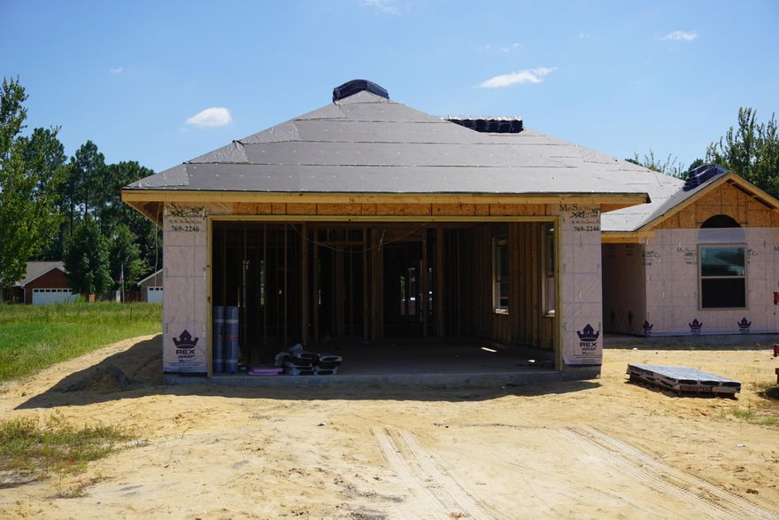 Under Construction, Pick Colors, flooring, fixtures. locally renowned builder, Split 3 bedroom 2 bath all brick home with front porch that offers master bath with his & hers double shower with Rain maker (3 shower heads) and shower seats on both ends, and walk in closet. The kitchen is a dream with all real wood cabinets, solid surface countertops, and stainless steel appliances. There are cabinets in the laundry room. Living room with and electric fire place and crown molding. Home comes with a security system and generator ready electrical outlet with cord. Outdoors there is an enclosed screen patio, outside shower and sprinkler system. Home is built to 140 MPH wind code. At Bylsma Manor Estates with many homes already built and waiting for you to tour today. Ask About No Closing Cost, No Down Payment