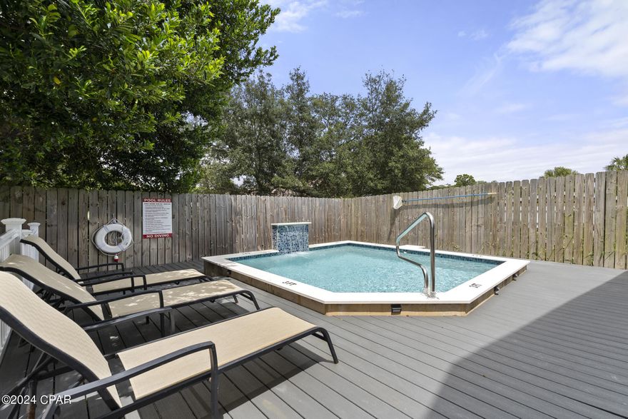 Welcome to your bright and beautiful coastal retreat in the heart of Panama City Beach! This meticulously decorated and furnished craftsman-style home is sure to captivate you from the moment you step inside. The beach walk is under 10 minutes stroll, so your days will be filled with relaxation and adventure. 

This craftsman-style gem offers three spacious bedrooms and two luxurious baths, all adorned with exquisite upgrades that elevate your living experience. The heart of the home, the modern kitchen, features stunning countertops, a top-of-the-line stainless steel appliance package, ample cabinet storage with soft close doors, and a convenient center island that doubles as a breakfast bar. The main living area boasts a spacious open-concept floorplan with a tray ceiling, allowing generous natural light to flood the space.

Enhancing your outdoor experience, the property includes a heated saltwater pool, perfect for year-round enjoyment and relaxation. You'll find that this home's lush landscaping, complete with a sprinkler system, adds to its overall charm and curb appeal.

Location is everything, and this home has it all. Situated perfectly between the beach and the enchanting Grand Lagoon, you'll have the best of both worlds at your doorstep. Plus, short-term rentals are allowed, making this a fantastic investment opportunity.