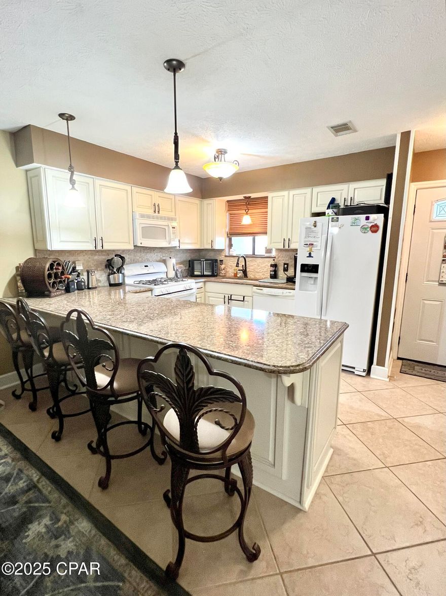 Check out this wonderful Glass Back unit located in the popular Gulf Highlands Beach Resort. With the summer season right around the corner, it is a great time to secure this Turnkey unit. Set up for success for an Investment property or for your Primary/Secondary new beach townhome. Short Term rentals are allowed here, as well as pets (2), and owners can own golf carts. You have two deeded parking spots right outside of your unit. You will appreciate the furnishings that are upscale and comfortable. This unit has 2 large bedrooms with Full ensuite bathrooms. The Master bedroom has a custom built in bunk above the closet that will have guest fighting over who will end up with it or use it for extra storage, your choice. The Laundry is upstairs in the Master's Jack-n-Jill bathroom. The Guestroom has a fully remodeled bath 
 and both rooms have new King beds and furniture. Downstairs has a 1/2 bath (also remodeled) Full Kitchen and Livingroom. There is a beautiful Queen Murphy Bed for extra guests if needed. Whether you are grilling out on your back patio or enjoying coffee on the cute, decked out front porch... you will not be disappointed!   The community has a lot to offer:  11 pools (5 heated), Tennis/Pickleball courts, Shuffleboard courts, play areas, community room/ meeting room, work out area, 18-hole mini golf course, and the private beach house right of the Gulf of America. Beach House has a great cafe, bar and Pool. So grab some lunch on the upper deck or head down to the beach thru the private access. Gulf Highlands Beach Resort is in the hub of the beach, surrounded by shopping, restaurants, ER Department, Storage facilities, Post Office and much more. The International Airport and Tyndall Air Force Base is about 40 min away while the Navy Base is less than 10 minutes.  Age, SF, and dimensions approximate, please verify if important.