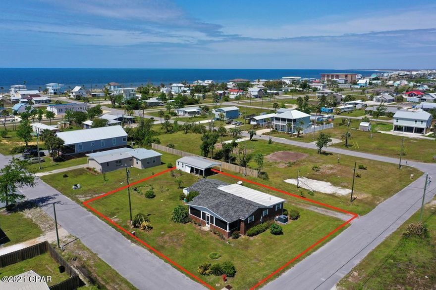 Brick home located only a couple of blocks from dedicated beach in Mexico Beach. Home sits on a large quiet corner lot. Neighborhood is quiet and makes for great golf cart rides. Newly remodeled with brand new appliances, flooring,paint, kitchen cabinets and counter tops along with new fresh tile in guest bathroom. Large screened in front porch makes for a great space to enjoy the coastal breeze and entertain guest.Tons of parking for RV's or boats and trailer. Lot is large enough to split to sell or build separate home as long as permits allow. No HOA fees and flood insurance not required