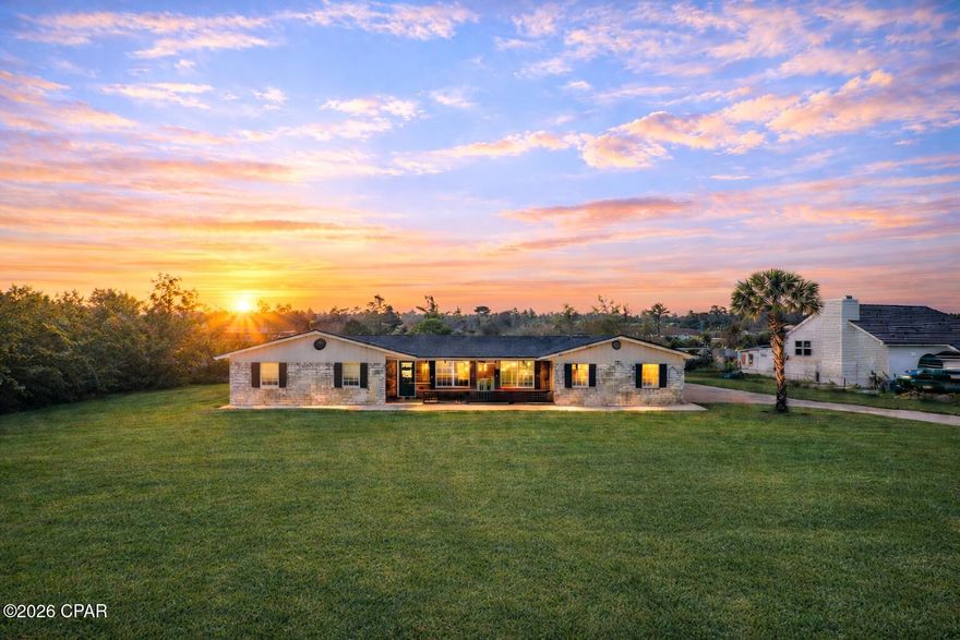 Welcome to 1026 Harvard Blvd - Your Dream Summer Oasis Awaits! This expansive 5-bedroom, 3-bathroom home with an in-ground pool offers over 3,000 square feet of flexible living space—perfect for large or growing families. Located less than a mile from North Bay and the sought-after North College Point area, this home sits in a prime Lynn Haven location surrounded by parks, including the Lynn Haven Sports Complex just minutes away. From the moment you arrive, the oversized front yard and generous lot size stand out, offering ample space for boat or RV parking—an ideal setup for outdoor enthusiasts. Step inside to a spacious, open-concept floor plan featuring updated flooring, quartz countertops, and a statement range hood in the kitchen. Two primary suites offer privacy and versatility—perfect for multi-generational living or visiting guests. The additional bedrooms are thoughtfully arranged on the opposite side of the home for optimal flow and functionality. A massive Florida/flex/game room spans the length of the home, offering endless possibilities for entertainment, a home gym, office, or studio. Outside, the fenced-in pool and covered patio area is the ultimate place to unwind including an outdoor shower—enjoy sun-soaked days or host summer gatherings in style. The freshly painted pool adds a clean, modern touch, and the expansive backyard even features a fully stocked pond and room to build a guest house or in-law suite. This property boasts the largest lot around currently on the market in the area with no HOA. Additional highlights include a newer roof, updated water heaters, and plenty of storage throughout. Homes of this size, in this location, at this price point are rare. Don't miss your chance—schedule your showing today with your favorite Realtor!