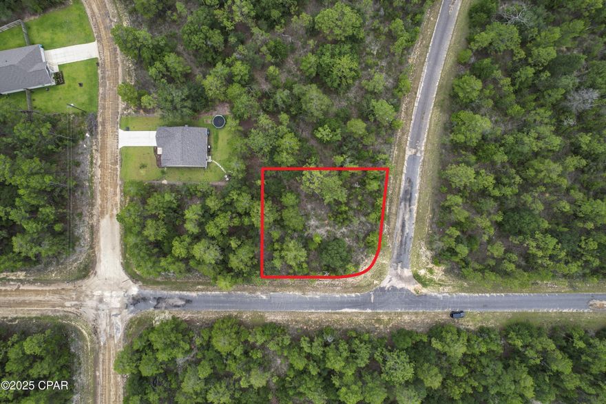 Corner wooded Lot in Sunny Hills Subdivision. Located north of Panama City and South of I-10 & Chipley. Close drive to Boat Lake & Sunny Hills Golf Course. Short drive to Hwy 77.