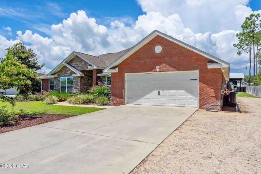 Welcome to 121 White Oaks Blvd. This all brick and stone, 4 bedroom home, sitting on one acre has the space you need. The back covered patio leads out to a inground, salt water pool with waterfall feature and splash pad to enjoy on these hot summer days. The privacy fenced in back yard has a side entry gate for access to the 42 x 98 pole barn with 50 amp plug and water. 32 x 24 of this is enclosed for a shop. This split bedroom floor plan has a large master bedroom. The master bath has double vanities, a jacuzzi tub, and two walk in closets. As you come through the front door there is a dining room to your right and the living room with a gas fireplace. Wood floors are throughout the home, carpet in the bedrooms and tile baths. The kitchen has granite counter tops, a ...click more breakfast bar and a breakfast nook with room for another table and nice oak cabinets. The three extra bedrooms are all nice size rooms with larger closets. Other features of this home- large propane tank buried on the side of home for the fireplace and water heater, gas stove would be an option if you love cooking with gas. Two 50 Amp plugs for an RV, one at the pole barn and one beside the garage. Great well water, seller said no filters are needed. Make your appointment to see this beautiful home today!