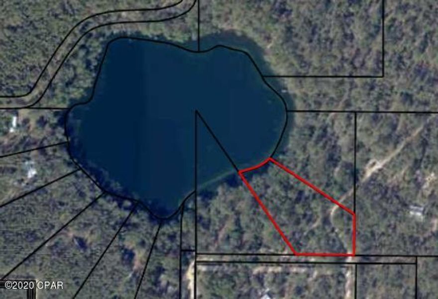 MOTIVATED SELLER. BRING ANY REASONABLE OFFER. This lake does NOT connect to White Western. Sunset lake ... N of Lynn Haven.  Whether you are looking for a peaceful home in the country or a weekend getaway retreat, you just found it. Lakeside property is becoming harder to find so take a look at this beauty. Situated perfectly for quiet days and spectacular sunsets. All this and you are still just a short drive to shopping, dining, and the ''world's most beautiful beaches''.

This little slice of Heaven is just waiting for you to make it your home.