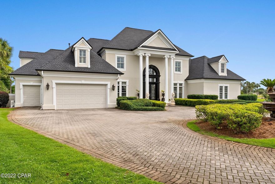 Nestled within the gates of the area's most desired neighborhood, this Legend Hills estate home is situated on a quiet Cul-de sac in the Fairways offering exceptional lakefront views while overlooking the renowned Bay Point Nicklaus Designed golf course. As you enter the front door, an architectural masterpiece awaits. This home provides over 5,500sf of living space and elegant finishes, including custom lighting, stone and hardwood floors, custom cabinetry, and a dramatic fireplace focal point. This is a bright and spacious home with high ceilings, custom crown molding and an abundance of natural light, is great for entertaining, with surround sound, built-in wine chiller, multiple indoor and outdoor dining areas, and a Chef Designed gourmet kitchen with high-end appliances, plus a full Butler's Pantry. Enjoy lake and Nicklaus course views along with amazing sunsets from your large pool deck. The first floor also includes a master wing, the master suite is elegantly designed and opulently appointed with generous square footage, incredible views through oversized windows, a separate sitting area, a luxurious ensuite, double boutique-style closets, as well as an additional bedroom. Three more bedrooms are located upstairs, along with a private office and without a doubt one of the most amazing playrooms that will delight all the kids regardless of age! 
The oversized climate controlled two-car garage features built-in storage and cabinetry and has a separate golf cart garage. It is perfect for all your adult toys! Just minutes from your door is the completely renovated  Bay Point Marina. This full service Marina is literally just minutes to the pass and can accommodate boats up to 130 feet! The Marina's proximity to the Gulf of Mexico and the Intracoastal Waterway make it a true paradise for boaters and fisherman and all those attracted to an elevated lifestyle on the water. All ages, SF and sizes are approximate.