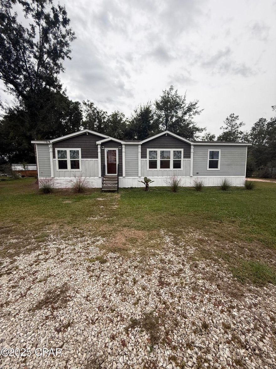 Welcome to this nearly-new manufactured home situated on a generous 0.60-acre parcel in serene Gulf County. Built in 2022, the residence offers approximately 1,578 sq ft of living space, featuring 3 bedrooms and 2 full baths. 
With central HVAC and forced-air heating, the home is move-in ready. The lot affords ample outdoor opportunities, mature surroundings, and space for additional amenities. Located in the peaceful community of Honeyville/Wewahitchka, this property combines modern comfort with rural charm. 
Don't miss your chance to own a thoughtfully built home in a tranquil setting — ideal for full-time living or a vacation retreat.