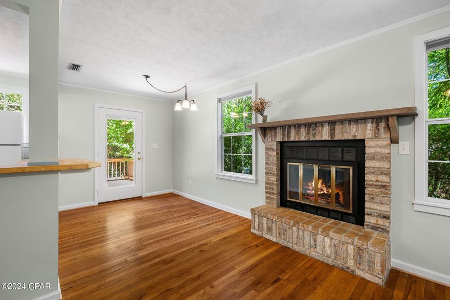 'CURRENTLY UNDER CONTRACT, SELLER WILL CONSIDER BACKUP OFFERS' A bit of forest in the city. This Cove cottage is surrounded by it's own little grove of trees.   Nestle in to your home featuring hardwood floors, a remodeled kitchen, large living/dining area and a huge deck to enjoy. Plumbing and electrical are updated and the interior was just painted.  There is a 17 x 12 workshop/studio/storage area in back. Don't miss this opportunity to own this well kept home in the Cove.