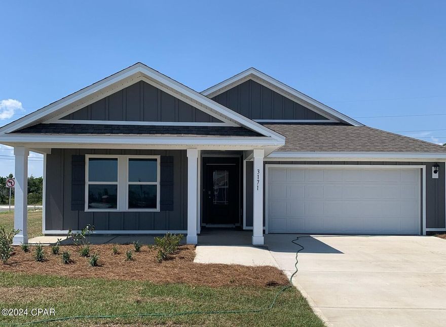 New Construction in Hodges Bayou. This Lakeside floorplan is located at 7121 Rachel Place.  Situated on a large corner lot, this 5-bedroom 3 bath, 2012 square foot home is an open concept floorplan.  The large kitchen island overlooks the dining room and living room allowing all to be together or doing individual tasks in each area. The main areas of the home as well as the bathrooms and laundry have beautiful, engineered vinyl plank while the bedrooms offer plush carpeting. The spacious primary bedroom leads to the bathroom featuring a large shower, double vanity, and a large closet. Hodges Bayou is just a short drive to schools, restaurants, beaches, and all that Bay County has to offer. Family time can easily be enjoyed biking or taking evening walks to catch those gorgeous sunsets over the bayou. Sidewalks wind throughout for you to enjoy nature at its finest.