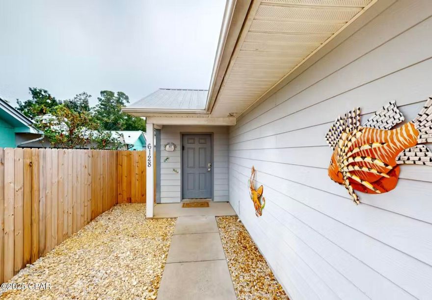 Discover coastal convenience with this fully furnished 2BR/2BA duplex unit, built in 2018 and ideally located on the east end of Panama City Beach. This well-maintained property features durable ceramic tile flooring, a metal roof, Hardie Board siding, and an efficient layout perfect for full-time living, a second home, or a turnkey short-term rental. Step inside to a bright and open living area, a modern kitchen with a center island, and two comfortable bedrooms, including a primary suite with a walk-in closet and en-suite bath. The home also includes a private fenced backyard and dedicated driveway parking for added convenience.
This unit is being sold fully furnished, making it rental-ready from day one. Each side of the duplex is responsible for its own lawn upkeep, and the property shares a lift station with the adjoining unit.
Situated just minutes from the sugar-white beaches of PCB, this home is close to popular local spots including Captain Anderson's, The Grand Marlin, Publix, marinas, parks and countless restaurants and activities. Enjoy quick access to Thomas Drive, Navy Base, and the Hathaway Bridge, ideal for both residents and guests. Whether you're looking to expand your investment portfolio or secure a low-maintenance beach retreat, this property offers comfort, convenience, and immediate rental income potential.
