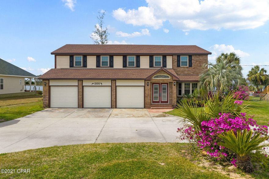 Waterfront Home with GULF ACCESS! Magnificent views and 100 feet of deep water on Callaway Bayou. Imagine enjoying beautiful Florida days watching the dolphins play from your own back yard! Stunning interior with custom finishes and vaulted ceilings in main living areas. New flooring throughout the home. Electric fireplace. Double hung impact windows and insulated garage doors installed 2020. Custom kitchen, truly a chef's kitchen, with all new stainless appliances including 36 inch induction cooktop. Two large living areas with water views and a wet bar! A 2019 Geothermal HVAC ''Energy Star'' system that pulls from a deep well. Owner est. electric bills for last 3 months between $85-$95/month. Large master bedroom and en-suite with walk in jacuzzi tub, and HUGE walk-in closet.