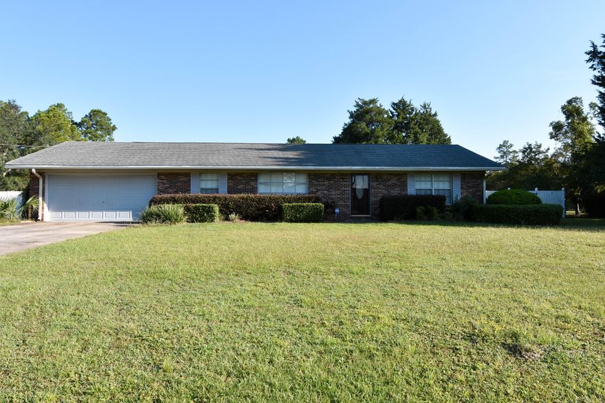 All brick home sits on almost 1 acre. It is located in a very nice neighborhood! Close to TAFB, Mexico Beach and Panama City Beach, shopping restaurants and churches. Refrigerator, dishwasher, and gas stove conveys.  There is a new shallow well, pump and tank for watering your lawn. There is a 18'x36' pool (8.5' deep). Plenty of room for a garden, there are crape myrtles, a gardenia, a fig tree and grapes growing in the back yard. The roof is 6-7 years old.  In the backyard there is a 20'x20' shed with roll up doors, AC, fan and electric wired. Fire pit in the back yard. The entire back yard is completeely fenced. Enjoy may gatherings with family and friends at the pool and fire pit. Don't miss seeing this house! Make your appointment today! All measurements are approximate, please verify.
