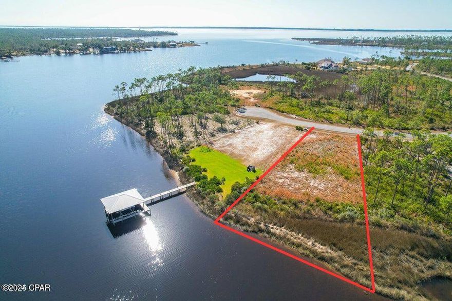 Fabulous waterfront property available to build your dream home! Lot is located in prestigious gated community of Laid bayou. Add a dock and you will be in deep water in 5-6 feet! Community pool and boat dock very close by, RV/boat storage available as well.Two miles of roads to walk or bike on you chose!  Come check out this lot and it's amazing sunrise and sunset views!