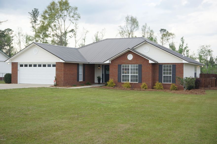 'CURRENTLY UNDER CONTRACT, SELLER ACCEPTING BACKUP OFFERS' BeautifulIt brick home minutes from town! Split bedroom design with a large master suite on the right side of the home & two spacious bedrooms across from the living space. It features a custom kitchen with granite counter tops with a beautiful tile floor. The master bathroom has recently been remodeled complete with his & her vanities with a make-up area in the middle. The owner has recently built a 24' X 36' pole barn with 10 feet of clearance & a concrete slab in the back for extra covered storage. New Marianna Highschool & Brand New K-8 School are right around the corner. Call today to see.