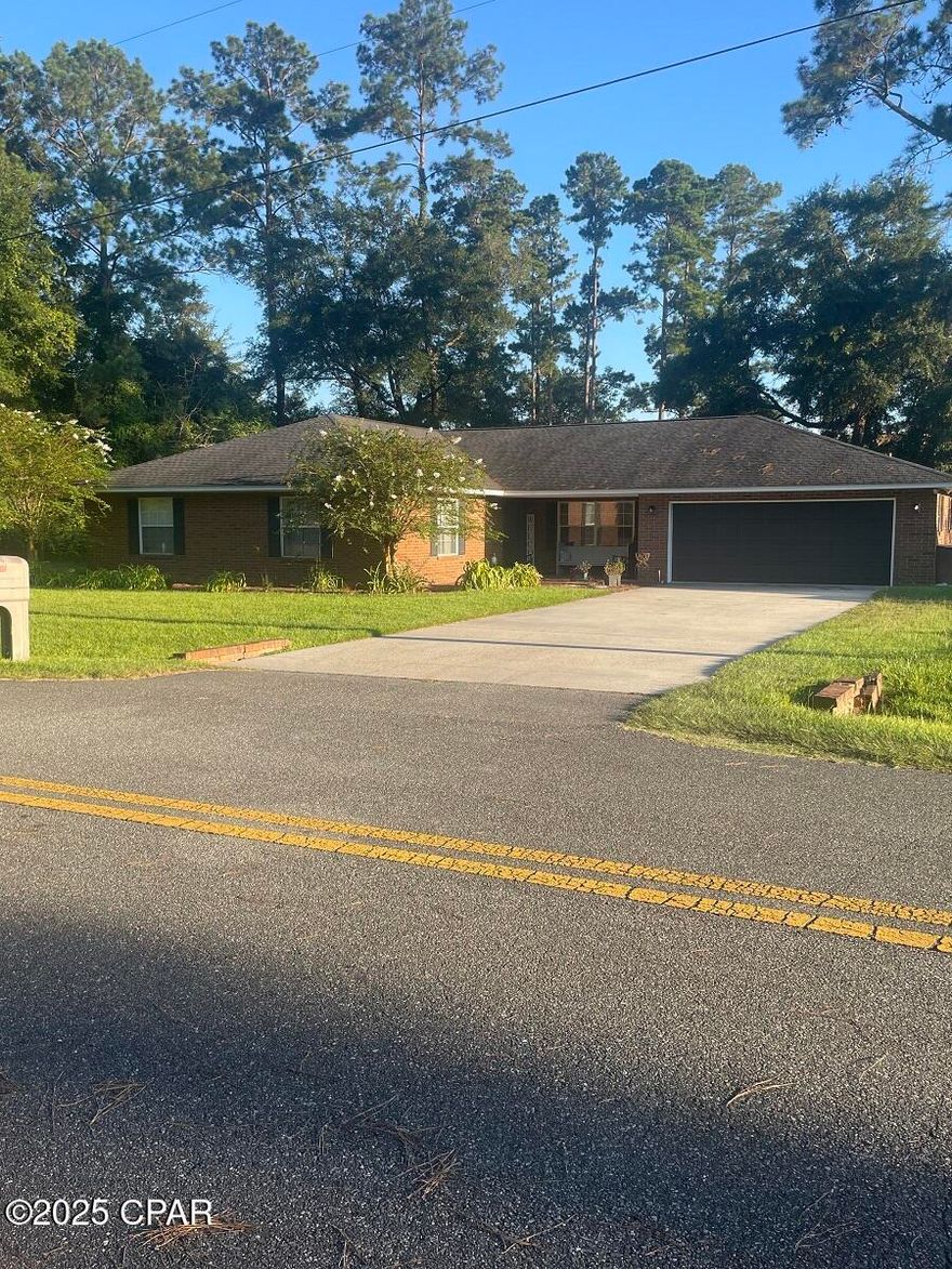 $334,000. PRICE REDUCED! When you step into the foyer you immediately feel ''at home'' in this 1993 brick home with 2,466 sq ft of heated/cooled living space. There is plenty of room for your family to enjoy! With 3 BR's, 2.5 baths, living room, formal dining room, den, breakfast room, kitchen, pantry (or mud room), and hallway closets, one that measures 6'8'' x 7'2''.... a bonus closet with shelving for organized indoor storage! The painted concrete floors in the den, dining room, breakfast room, and master BR are etched with large squares. Two of the BR's have carpet, the foyer and hallway have lovely parquet, the kitchen and living room have vinyl plank, and the bathrooms have tile floors. Laundry hook-up and recently-replaced water heater are located in the enclosed 2-car garage, which has an automatic door opener. The roof was replaced in 2019. (This home was originally wired with a security system that could be updated and activated, if desired. The in-ground sprinkler system has not been used in years, but it could be revived/reactivated if one chooses to use it.) Kitchen appliances include stove, refrigerator, dishwasher, microwave, and garbage disposal. Located inside the city limits of a small NW Florida town, children could walk 1.5-2 blocks to the local high school, and the K-8 school is only a 3-4 minute ride, as well. This property is situated in a quiet neighborhood and features a fenced back yard, paved streets, city water, city sewer, and garbage collection. What more could you ask for?! Schedule your viewing of this comfortable home today and start making memories with your family! $334,000.