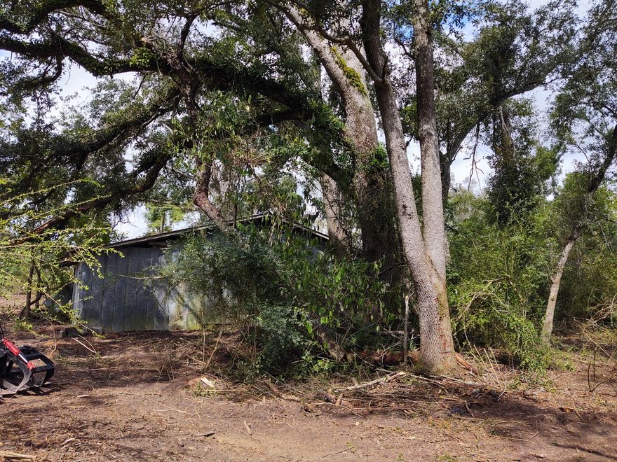 Beautiful Mini- Ranch in the country just South West of Marianna, FL  Beautiful 8.5 acre parcel with existing 30x40 barn.  Heritage Oaks surround the site, along with a fishing pond, and beautiful flowing creek just north of and behind the barn site.  This is the perfect mini-ranch, even comes with a historic cattle feeding trough, old log trailer, and many other surprises!  Call for an appointment to see this marvelous property today, before it is gone!