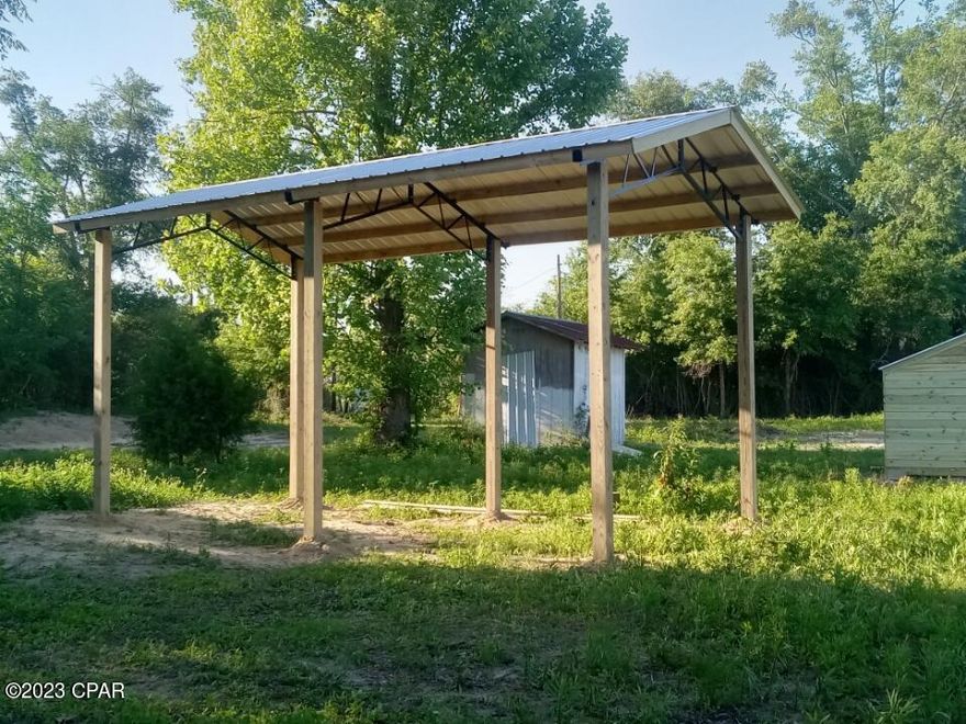 1 acre secluded property at 7705 Homestead Road. Brand new 24'x12' Pole shed and lot also has a 10'x10' shed. Well, septic and power. Cleared and ready for mobile home or build your home/cabin. Backs up to very large hunting preserve.