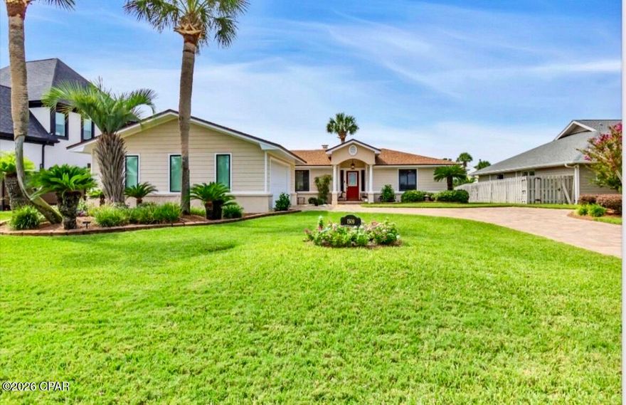 Nestled within the private, gated community of Bay Point, this stunning 3-bedroom, 2-bath waterfront home embodies the relaxed coastal lifestyle, centered around beautiful water views. The home features a bright sunroom and a spacious deck overlooking the canal - perfect for enjoying Florida's year-round outdoor living.

As you arrive, you'll be welcomed by a beautifully manicured yard with lush tropical landscaping. The brick paver driveway includes a convenient side parking area beside the two-car garage, offering plenty of space for vehicles, water toys, or even a golf cart. Situated on a large lot with approximately 70 feet of canal frontage, the property offers picturesque water views where two canals meet.

Inside, a welcoming foyer opens to vaulted ceilings, abundant natural light, and an open-concept living space designed for easy Florida living. The living room features a cozy wood-burning fireplace, tranquil canal views, recessed lighting, and a built-in entertainment center complete with a convenient wet bar that serves both the living and dining areas.

The spacious modern kitchen is ideal for entertaining and everyday living, offering generous cabinet and counter space, a pantry, breakfast area, and a center workstation island - perfect for preparing meals or gathering with guests.

The primary suite is privately located on the opposite side of the home and includes an oversized custom walk-in closet and a dedicated office space overlooking the water. The spa-like primary bathroom features a soaking tub, walk-in shower, and dual vanities. Both the office and living room provide access to the waterfront sunroom, creating a seamless indoor-outdoor living experience.

Just outside the sunroom, a large open deck leads down to the seawall and private boat dock, offering ample space for larger boats. From your backyard, enjoy a scenic boat ride through Bay Point's canal system to the open bay and nearby Shell Island.

Residents of Bay Point enjoy 24/7 roving security, golf-cart-friendly streets, a Jack Nicklaus-designed golf course, a full-service marina, scenic canals, and an on-site restaurant. The home is also just a short drive from St. Andrews State Park, the ''World's Most Beautiful Beaches,'' as well as local dining, shopping, and entertainment.

This exceptional property perfectly blends comfort, style, and the ultimate waterfront coastal lifestyle.