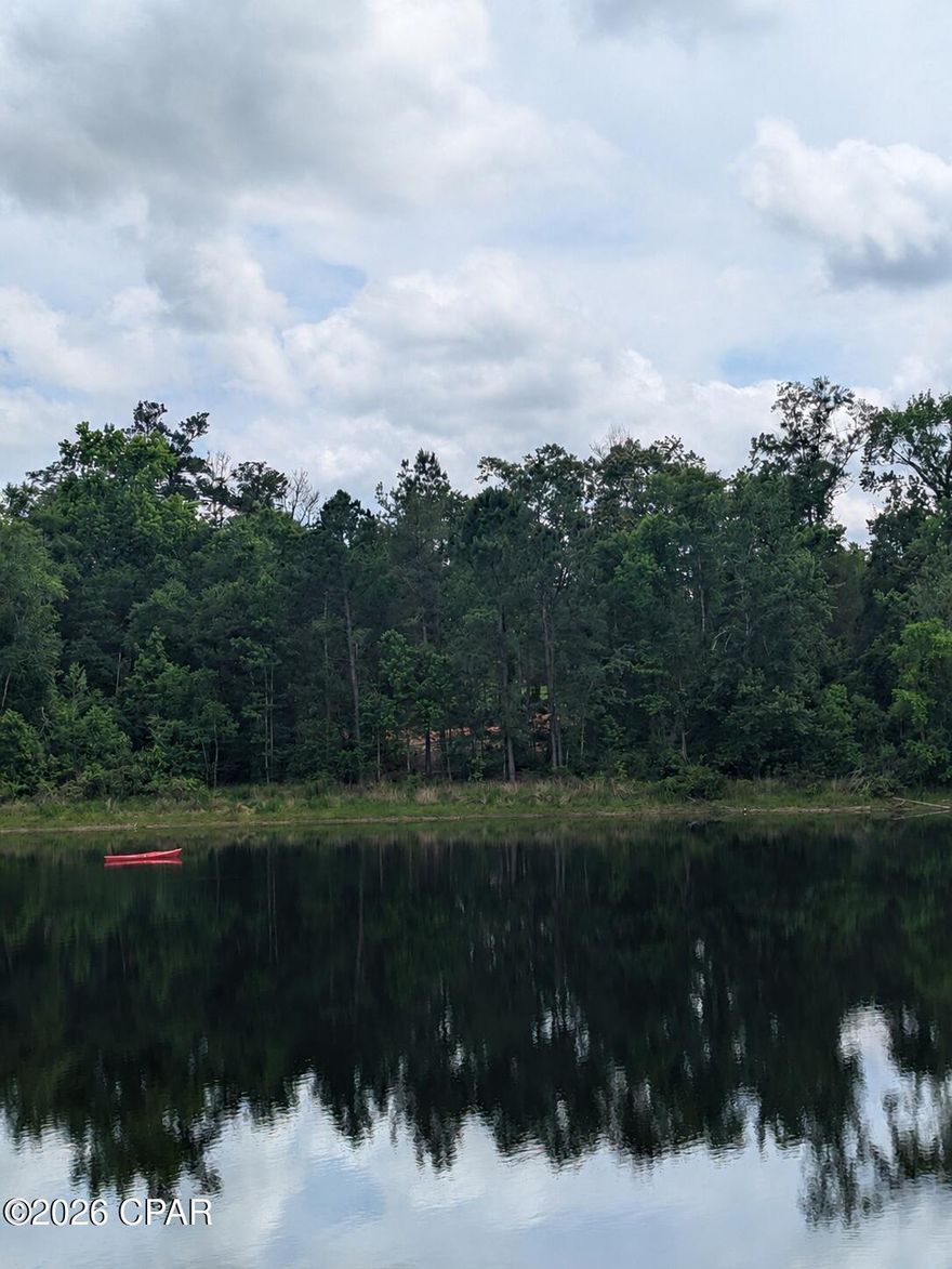 Rare opportunity to own CLEARED, LAKE FRONT land on beautiful Dogwood Lake in Bonifay, Florida, located within the Dogwood Lakes Golf Course community with NO HOA restrictions. This lakefront lot offers the perfect setting to build your dream home, weekend retreat, or private getaway surrounded by peaceful natural beauty and relaxing water views. The property has already been cleared, saving valuable time and expense as you begin planning your future build. A storage shed is already on site and will convey with the sale, providing convenient storage for tools, equipment, or lake toys. Enjoy fishing, kayaking, boating, and golf course living while maintaining the freedom and flexibility of no HOA. Conveniently located near Bonifay shopping, dining, and local amenities, this property is ideal for buyers searching for Florida lakefront property, vacant land on Dogwood Lake, golf course community living, or a private waterfront investment opportunity in Holmes County.