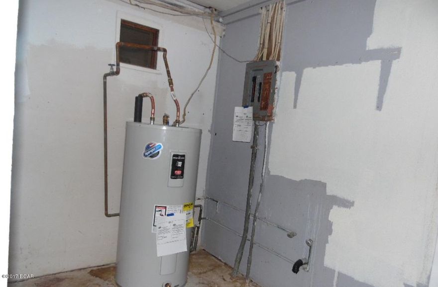 * All parties must sign a Hold Harmless Agreement prior to entering.  The property will be shown by appointment only.* Home is in need of  major repairs and renovation and has substantial structural issues. The main home features 3 bedrooms 2.5 baths. There is an add on bedroom adjacent to the garage and a detached mother in law/guest home that features 1 bedroom 1 bath accessible only from exterior stairs on 2nd story. This structure needs major renovation/repairs. The corner lot is beautiful and centrally located would make a great new home-site area. Prior to seller receipt and approval of the full title package from foreclosure, title to the property will be conveyed by a quit claim deed. Sold As-Is.