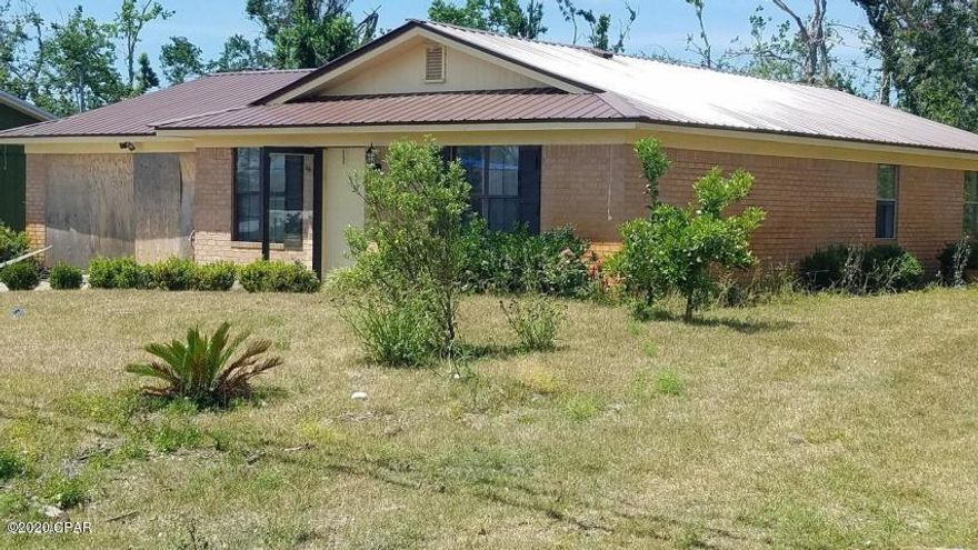 LARGE price reduction and $2,000.00 selling Bonus to buyers agent. This property is less than 10 minutes to Tyndall. This brick house would be very nice with a little TLC.  The house has a metal roof and structurally in good shape. It is in need of refurbishing. Nice neighborhood with good proximity to schools and services. Nice size backyard with a 2 car garage. This would a excellent investment rental property or permanent home.