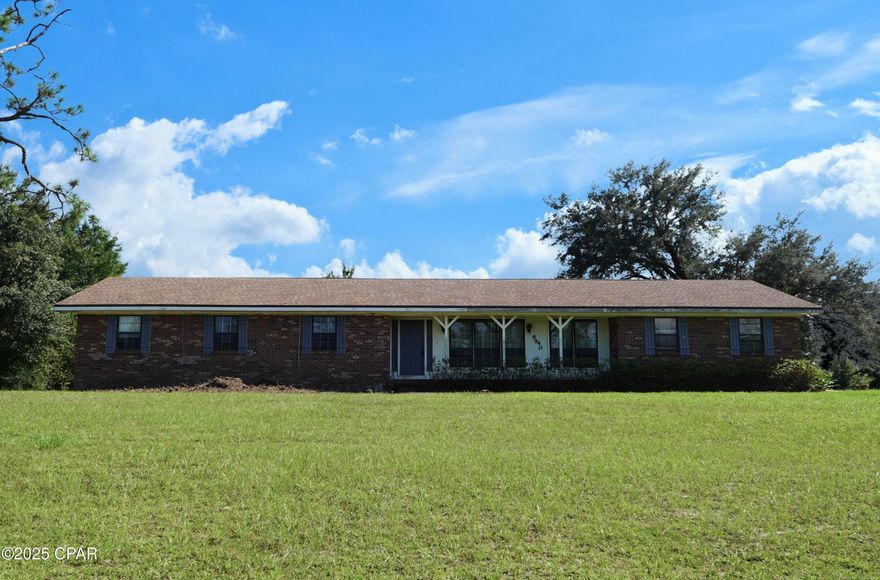 CURRENTLY UNDER CONTRACT, SELLER WILL CONSIDER BACKUP OFFERS

Discover this charming four-sided brick ranch home on a spacious 4.2-acre lot in Youngstown, FL! 

The 2,062 sq ft residence features 4 bedrooms, 2 bathrooms, and a solid 👷‍♂️1975 construction with a roof under 10 years old. While the interior is dated and ready for your personal touch, the brick structure offers great potential for 🛠️sweat equity.

Outside, enjoy a 488 sq ft cinder block outbuilding with a metal roof, perfect for storage or hobbies. The property includes two power meters—one on the home and one on a pole for easy expansion—along with septic and well water systems.

Zoned R-2, this versatile lot can be subdivided for additional residential structures (up to multi-family like duplexes), making it ideal for creating a generational homestead or investment opportunities. 

Whether you're envisioning a family compound or exploring options like a tiny home community (note: mobile homes are typically allowed in R-4 zones, not R-2; buyer to verify all zoning, building codes, and uses with Bay County Planning

Don't miss this rural gem—perfect for buyers ready to invest time and effort into their dream property!