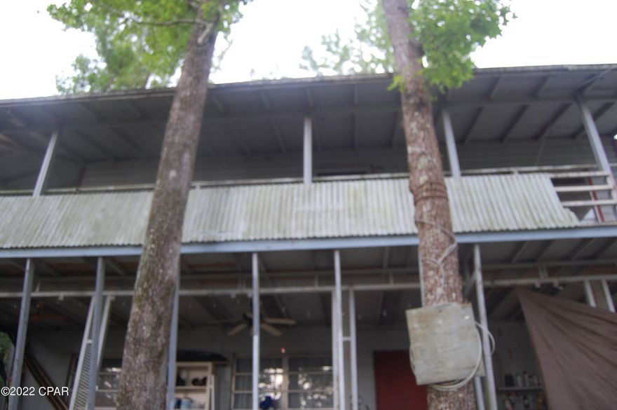 Rare find! Over 3 1/2 acres of beautiful waterfront property on Ocheesee Pond. with 400 ft. on the water. No value on two story home with extensive storm damage. Property is high and dry. Also includes parcel #18-3N-07-0313-00E0-0010