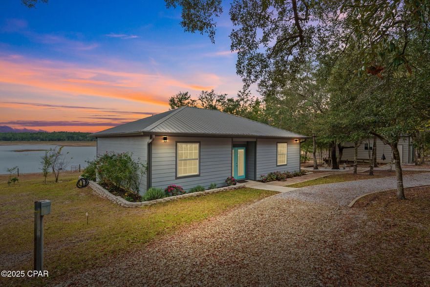 Welcome to 4958 Lake Ridge Road — a rare opportunity to own over 5 acres of manicured, waterfront paradise on beautiful Long Lake.

This secluded property offers complete privacy with no neighbors in sight, a fully fenced perimeter, and exclusive access through an HOA-maintained security gate, ensuring peace, quiet, and security at all times.

Step onto the expansive back deck and take in panoramic lake views with over 200 feet of pristine lake frontage. Watch bald eagles nest across the property, see deer wander to the water's edge, and enjoy some of the area's best bass fishing just steps from your home. Boats are allowed, making this the ideal retreat for anyone who loves life on the water.

The land itself is beautifully maintained with orange and lime trees, wide-open green space, and plenty of room for animals — horses are allowed.

A versatile 18x25 detached, insulated garage offers ideal storage or workshop space, and the adjoining air-conditioned dog pen provides comfort for pets year-round. Inside the home, enjoy modern conveniences including peaceful lake views from multiple vantage points.

Located in a NO flood zone, this property combines natural beauty with security and usability — the perfect blend of homestead, hideaway, and lakefront living.

Experience unmatched privacy, wildlife, and waterfront living at 4958 Lake Ridge Road. Properties like this rarely come available.