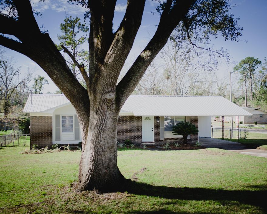 Newly remodeled home!  This home features three bedrooms and 1.5 baths.  The dining area is open to the kitchen.  The kitchen features a large pantry.  Home has been updated to include new paint and flooring throughout, as well as new cabinets, roof, and ac... Flowerbeds feature drip irrigation.  All this on corner lot close to downtown Marianna for convenience to shopping.