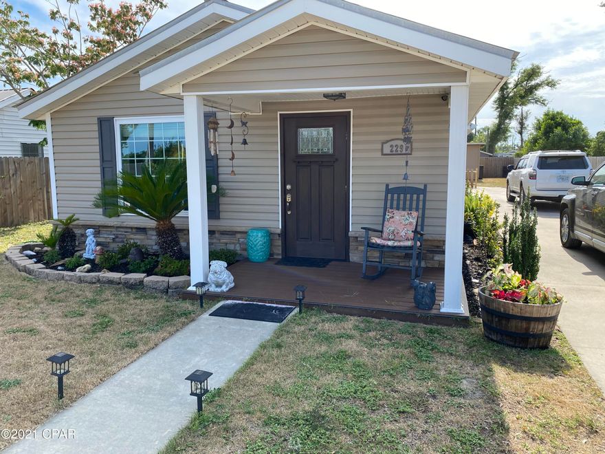 This home has been upgraded and when you see it you will fall in love, beautiful tile throughout. This home as you start in the front door you will see the attention to detail. If you enter the side door you will be walking into the foyer. The Kitchen has a tile backsplash with granite countertops  and and has a large pantry. Both master bath and guest bath have granite countertops. Two good size bedrooms, the master suite has the master bath with an amazing shower you will want to see. Privacy fenced around with a security system as well. Crown molding throughout most of this home, a true beauty.