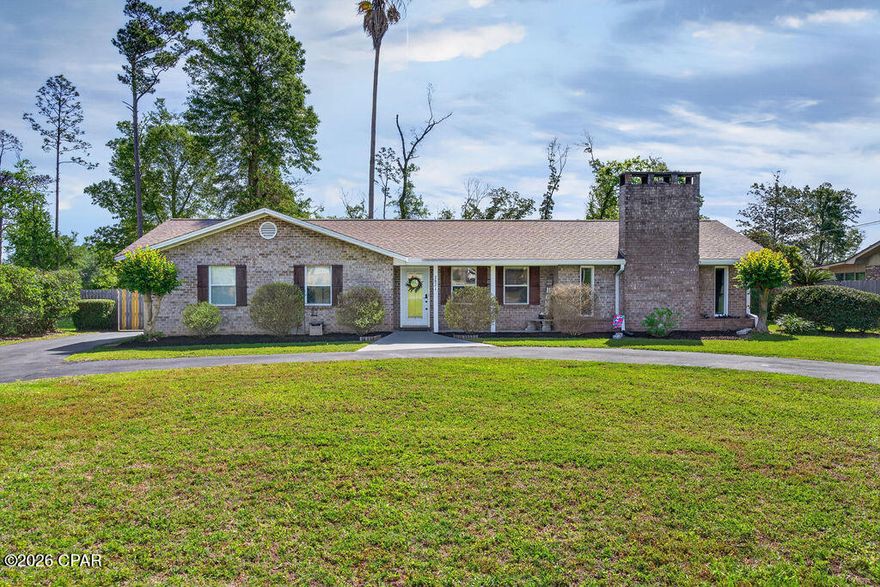 Welcome to 2871 Wildwood Circle, a well-maintained brick home offering comfort, functionality, and thoughtful updates throughout. Situated on a circle drive for easy access and added curb appeal, this property features a durable shingle roof replaced in December 2018. Inside, the inviting living area showcases beautiful hardwood flooring, a cozy fireplace with gas logs, and a large cased opening that flows seamlessly into the dining space--perfect for everyday living or entertaining.

The kitchen is equipped with solid surface countertops and stainless steel appliances, including a dishwasher, refrigerator, stove, and microwave, along with a convenient bar area and space for an eat in area. This home offers three bedrooms and two bathrooms, with one bedroom currently serving as a spacious closet but easily convertible back to its original use. A tiled sunroom provides a bright and relaxing space to unwind year-round.

Step outside to enjoy a screened-in, in-ground pool surrounded by a privacy-fenced backyard--ideal for enjoying warm Florida days. Additional features include a large detached garage with an upper-level space that is finished with sheetrock and carpet, which could be use as a mother in law space. Major updates provide peace of mind, including a septic system update in 2020, pool liner replacement in 2019, pump motor replacement in 2024, and a new water heater in 2026. Conveniently located near Highway 90, this home combines accessibility with a comfortable, private setting--ready for you to make it your own.