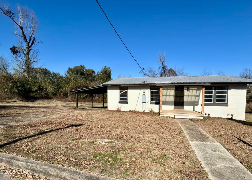 Newly Renovated!  This Three Bedroom One Bath has been completely updated with a Front Porch and a carport.  Nice size lot in town on paved road, with a large back yard.
Nice back porch to watch the kids play.