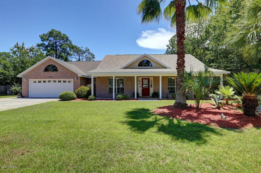 Panama City Beach 4 bedroom 2 bath home has desirable curb appeal with it's manicured lawn  and lush landscaping and is located in desirable Colony Club.  This stunning all brick, split floor plan home offers porcelain tile and beautiful hardwood flooring, with carpet in bedrooms 3 and 4, very open concept floor plan,  beautiful built ins on each side of the gas fireplace,  dining room with tray ceiling, which flows into the gourmet kitchen offering a gas stove, plenty of counter and cabinet space, breakfast bar, solid surface counter tops and much more. Master suite is very spacious with it's tray ceiling, huge walk in closet, double vanity, garden tub lined with decorative tile and to complete the room a nice dressing area.  

All bedrooms are very spacious with plenty of storage space. French doors lead to the 432 square feet screened porch, complete with ceiling fans making it the perfect place to entertain then you can stroll right in and enjoy the gunite pool.  Within the past two years the hot water heater, HVAC-Carrier, pool pump and filter have been replaced.  Irrigation system and private well maintain the lush lawn.  House has been well maintained, and is just minutes from Pier Park, conveniently located near numerous restaurants.  Make your appointment today!! All ages, sizes including sq. ft. are approx. measure if important.