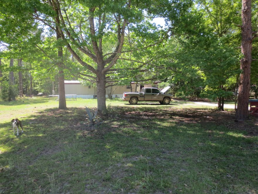 Not in a flood zone, mobile home has no value sold as is where is no warranties. Located on 1 acre of land. All room sizes are approximate, measure if important.