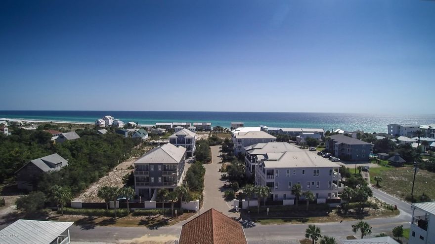 ~~PRICE CORRECTION~~Inlet Beach home just 250' from the beach. Designed by a European architect with concrete walls, metal roof, elevator, endless pool/spa, pizza oven, tankless water heater, gas fireplace, marble counters, fenced yard, plantation shutters, double car garage with lots of storage. Attic storage area has been made into a workshop with plywood floors, shelving and natural light from two windows. Stainless kitchen appliances and a gas stove. One of the sitting areas could be a 5th bedroom. ( It also has a closet) This home has been a second home and has not been a rental but could be used as one like others on the street. Being sold furnished as seen (excluding the master bedroom mattress) Call for your private showing today!