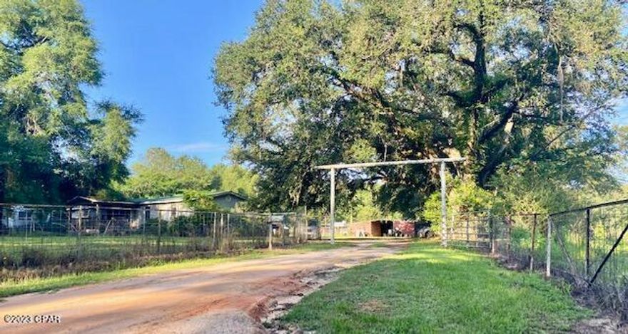 MLS Entry Only - Beautiful acreage consisting of an older manufactured home, barn, two ponds and a creek running through the property.  Property has fencing in place for horses and other animals.