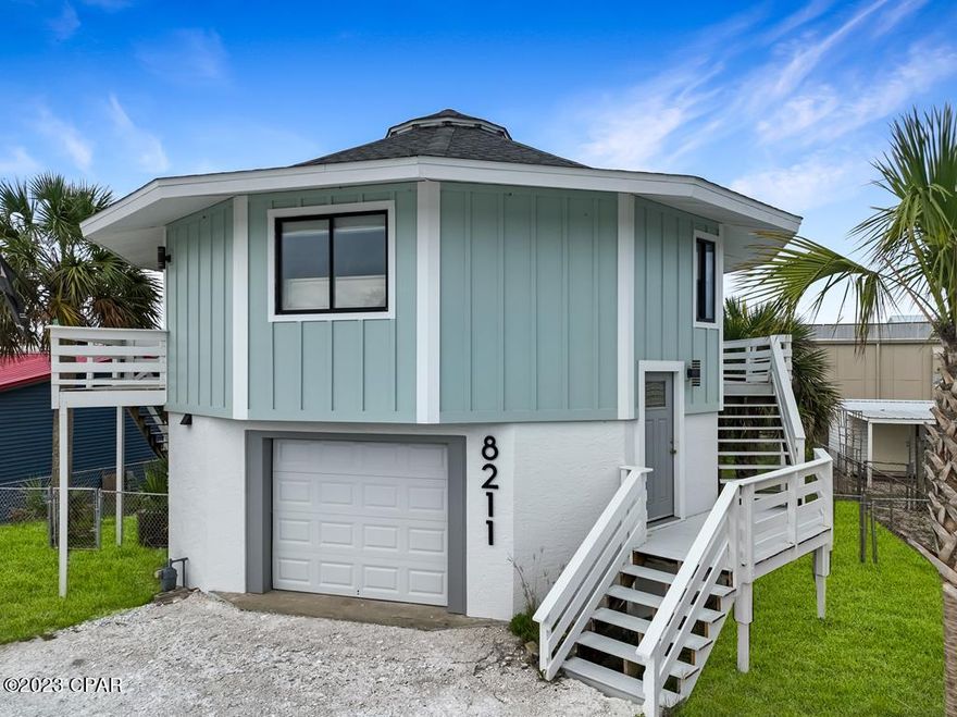 TASTEFULLY REMODELED 2BD/2BA GULF VIEW HOME JUST A SHORT STROLL TO SUGAR WHITE SAND BEACHES AND THE GULF OF MEXICO! Welcome home to this fully renovated beach house featuring intricate tile work throughout, LVP flooring and stainless steel appliances. Quartz tops complimented by white cabinetry & modern fixtures complete the kitchen design. Ideal for entertaining, the open and airy living area extends to a wrap-around porch overlooking a fenced backyard with breathtaking sunset view. Included on the main level is a guest room with private entry along with a nicely appointed shared bath. Sleek stainless railing and live edge oak stair treads lead to the lower level suite. This inviting space also has a separate entry through the garage or the patio doors off the deck. A private ensuite with plenty of storage and an oversized shower stall round out the space. White sand beaches and shoreline fishing are just steps away. Make this your next investment property or vacation hideaway. Take the 3D tour & call today for a showing!