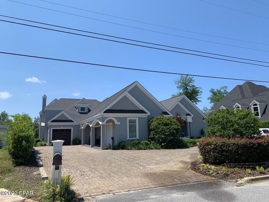 This custom built home offers 4 spacious bedrooms all with their own baths and that is just the start.  Well thought out, the floorplan is great for the growing family, the soon to be empty nester or those looking for a great waterfront home.  The interior finishes are everything you would expect.  Hardwood floors through the entire home except the wet areas. All cabinets through the home are custom built with add hand carved design in the kitchen and half bath. Both first and second floors have identical very large sun rooms that are full of beautiful water views. Geothermal heating and air with zoned areas for more efficient heating and cooling.  The trim work and doors are all EF San Juan top quality. The exterior is just as great. 4 car park garages with 3 in the main and 1 in the extra, both are attached. Out back and off both family rooms is the awesome back porch.  All brick pavers surround the custom in ground pool.  The infinity pool offers a swimming lane that opens to the large swimming area.  The covered outdoor kitchen is fully equipped to cook and keep cold anything you needs.  Enjoy the cool evenings by the large outdoor gas fireplace.  Keep the boat behind the house art the dock and good boatable water.